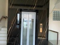 Thang máy ốp đá nung kết nhập khẩu màu đen