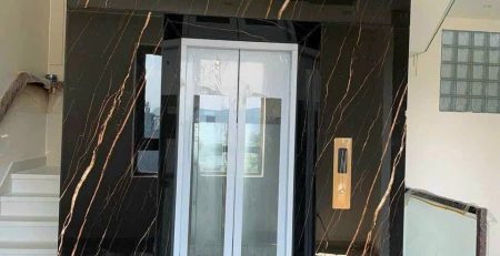 Thang máy ốp đá nung kết nhập khẩu màu đen
